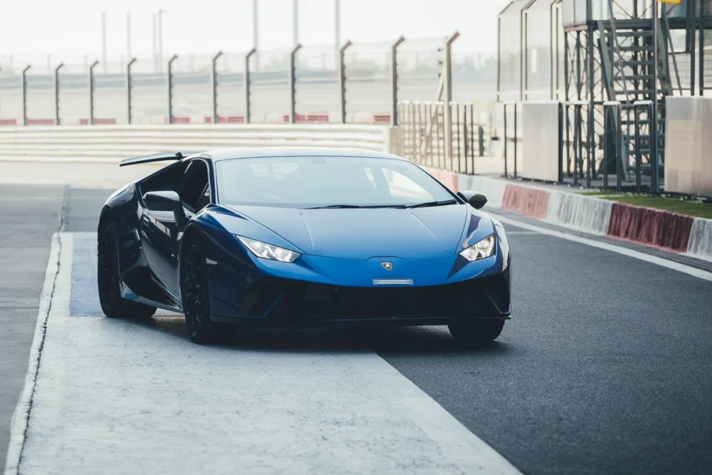 Blue Lamborghini Huracan with door raised