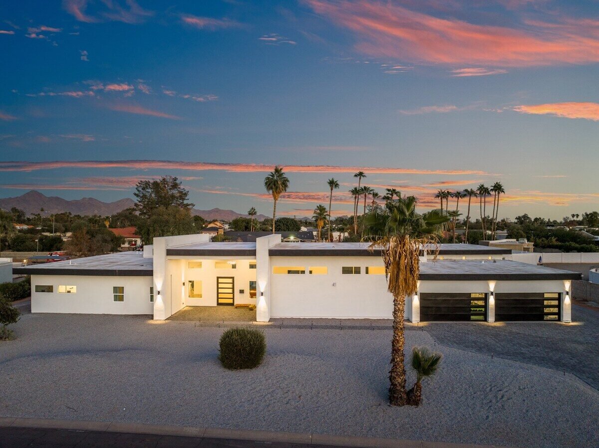 Modern white villa front exterior at sunset in North Scottsdale near Cactus Park