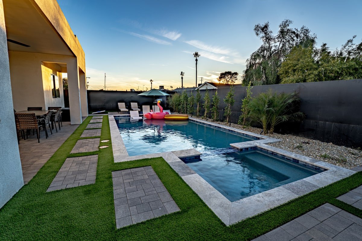 Heated pool with attached hot tub at The Estate